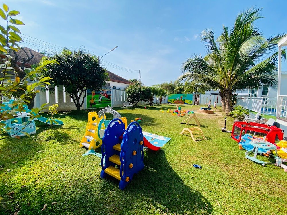 Limpopo kindergarten playground on grass with a slide, swings and climbing frames